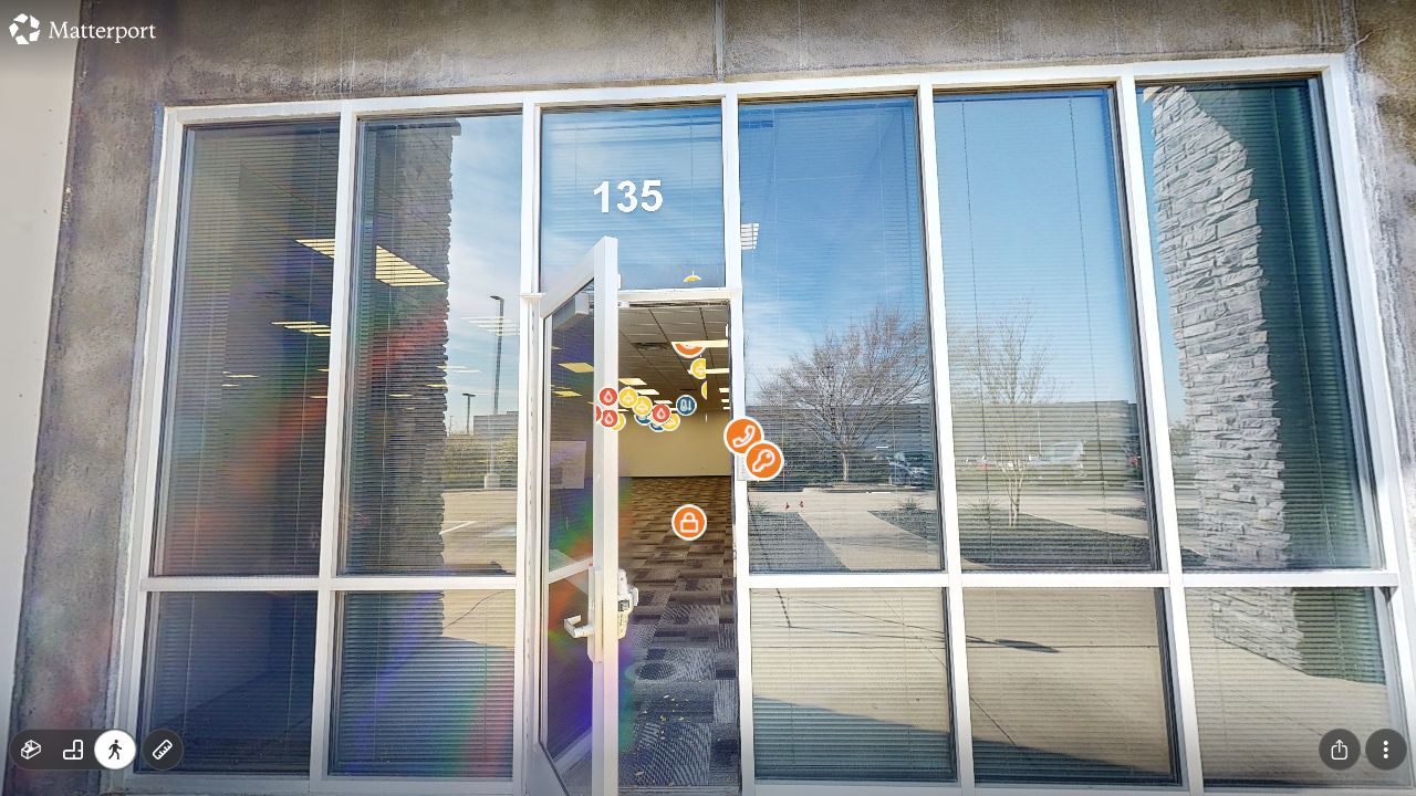 Office entrance and workspace with device-specific icons for access, electrical, and other visible assets
